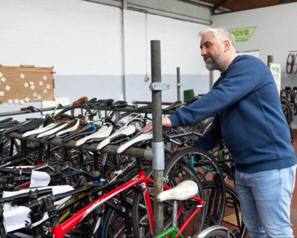 A man looking at some bikes